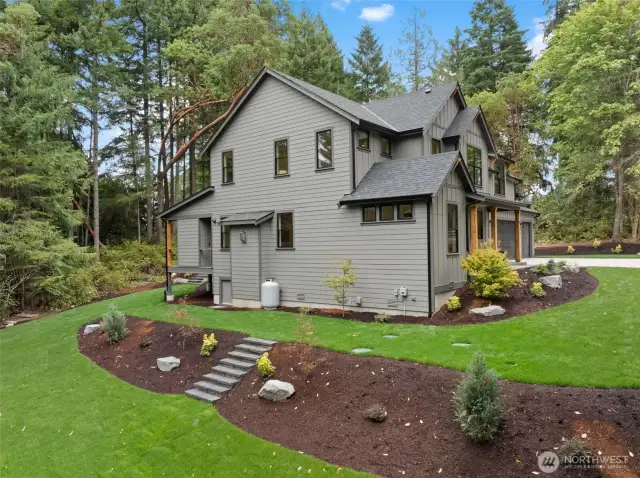 Fully landscaped yard with stone steps