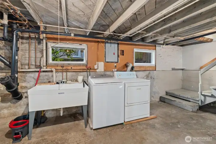 full sized laundry is here along with a double sided utility sink.  Easy plumbing access for any future remodels.
