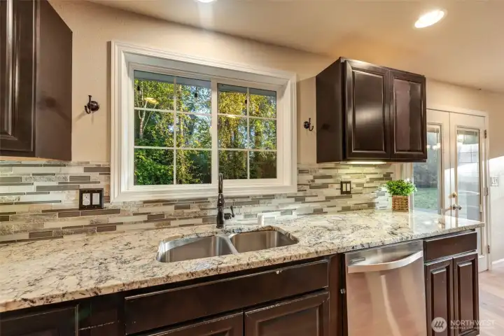 Kitchen overlooks the private backyard!