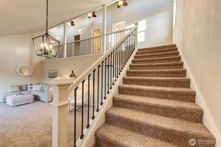 Welcoming staircase to the 3 perfect upstairs bedrooms.
