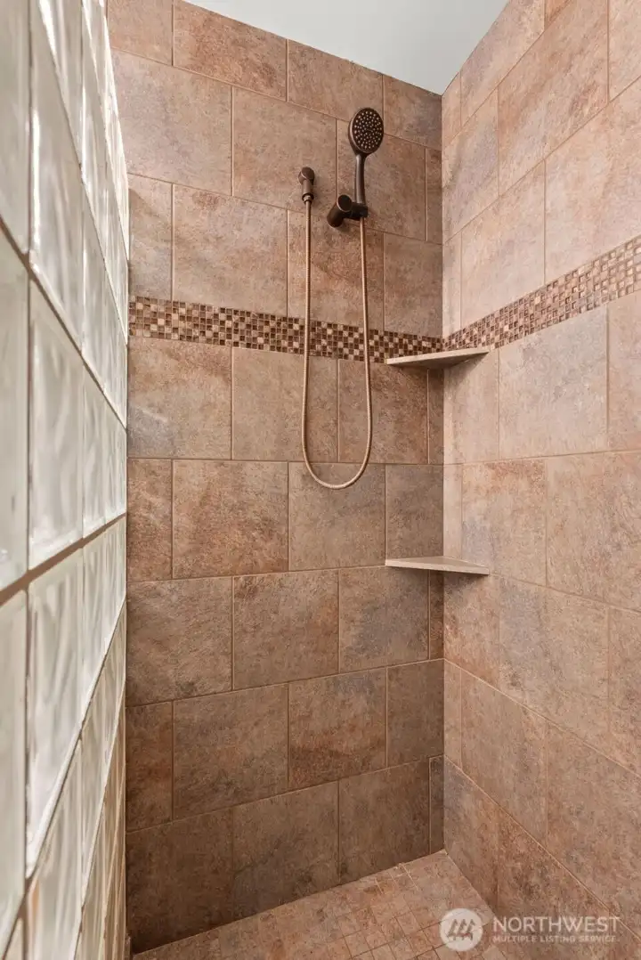 Beautiful tiled walk-in shower in primary bath