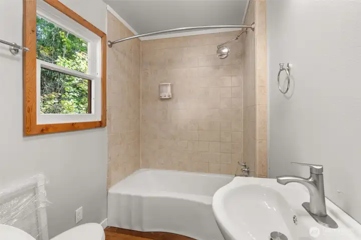 Main bath with tub and shower