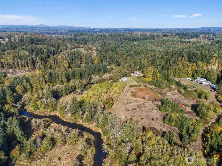 Salmon Creek is at the back end of the property winds up along the side around the orchard