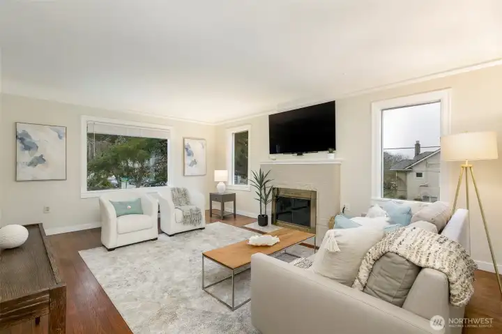 Living room with wood-burning fireplace.