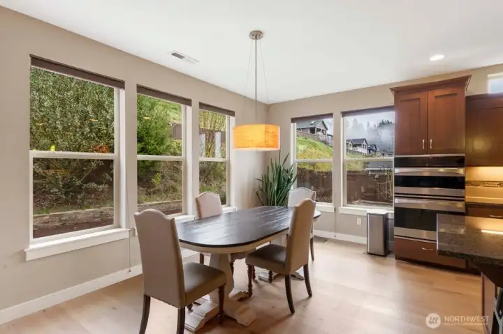 Spacious dining area sits perfectly the beside the kitchen and great room, creating an inviting hub for everyday meals or special occasions. A door opens directly to the covered deck, making outdoor dining and entertaining a breeze.