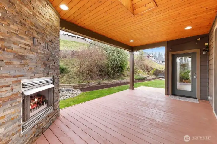 Covered Deck & Outdoor Living space.    Stunning covered deck with skylight and built-in fireplace creates a true four-season outdoor living space. Recently refinished (2026) and fully lit for evening gatherings, this space also features a gas BBQ hookup and TV connections—perfect for game days, cozy nights, and effortless entertaining.