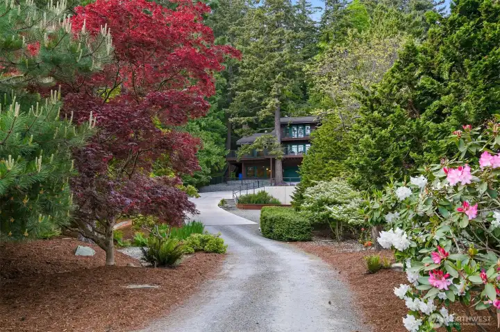 Set back on .59 acres, offering serenity and privacy, enjoy a parklike entrance. Set back on .59 acres, offering serenity and privacy, enjoy a parklike entrance.