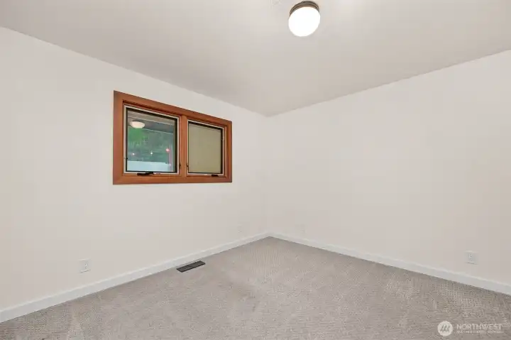 Guest bedroom on the main level. Guest bedroom on the main level.