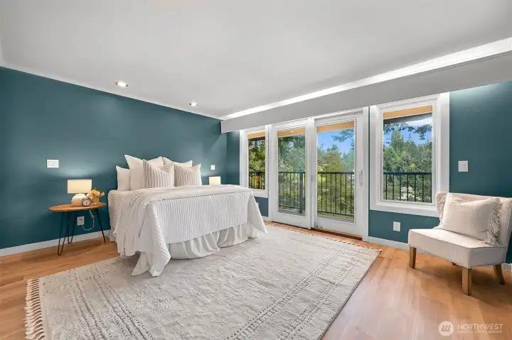 Primary bedroom with its own sun deck. Primary bedroom with its own sun deck.
