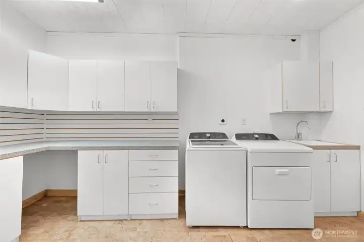 Lower level laundry room with half bath and plenty of storage. Lower level laundry room with half bath and plenty of storage.