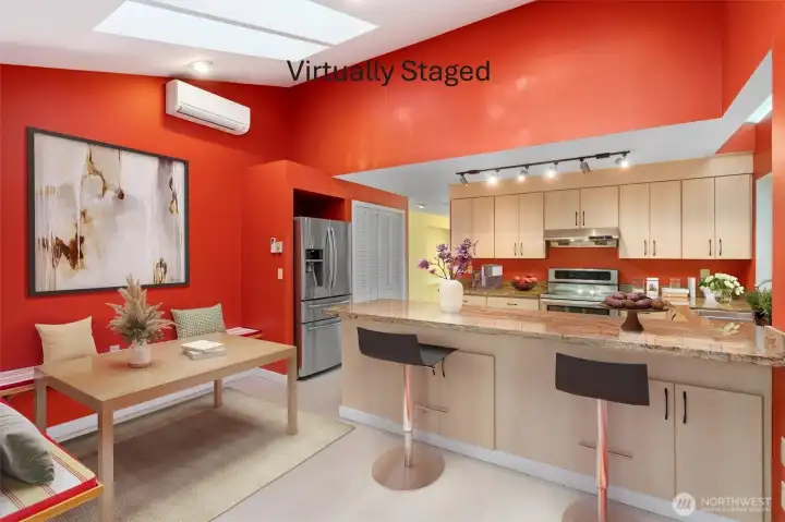 Vaulted ceilings and skylights flood the kitchen with natural light, while a built-in seating area and breakfast bar offer inviting spots for casual dining. Granite countertops, stainless steel appliances, and a generous pantry round out a kitchen that's as practical as it is beautiful.