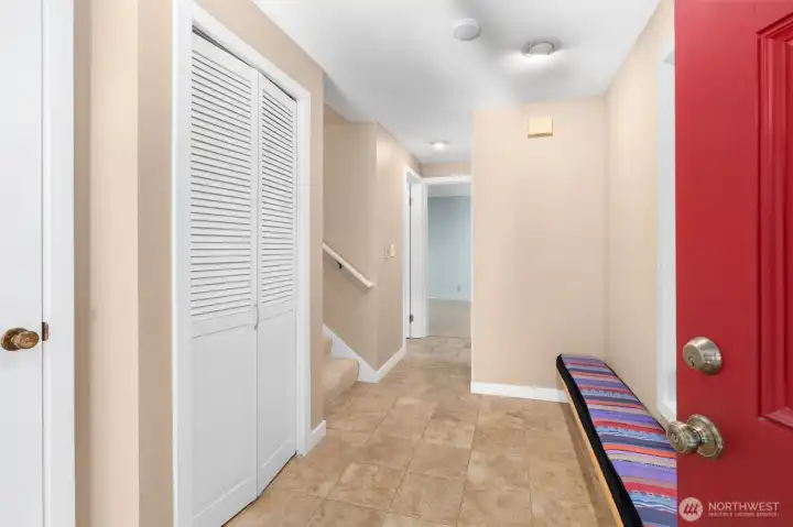 The entry makes a strong first impression — built-in seating and ceramic tile flooring offer a functional, polished welcome from the moment you step inside.