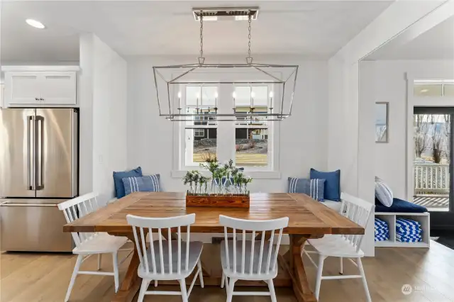 Classic dining room w/ oversized table & built-in seating bench; designed for both everyday living & entertaining.