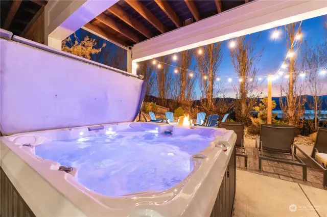 Twilight view of the home's private hot tub w/ stunning west-facing uplake views of Lake Chelan.