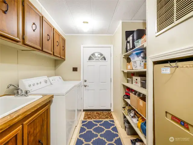 A large utility room with all these cupboards and shelves is a must!