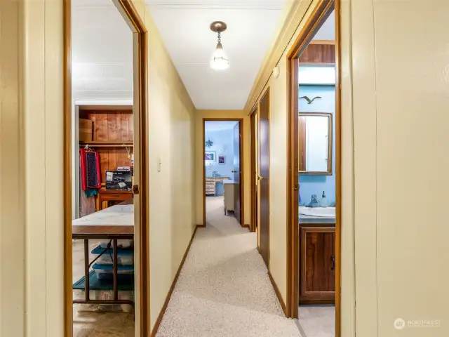 Hallway with Bedroom #1 on the left and the main bath on the right.