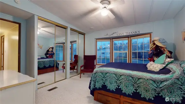 The primary bedroom has a large closet, and the bay window faces the front yard.