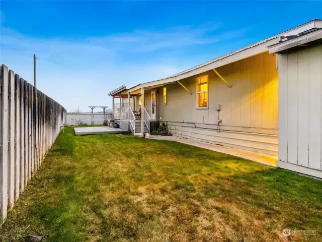 Back yard with access to the garage/storage room.