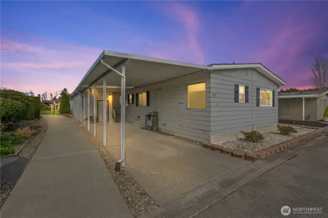 Shot of home by carport-evening