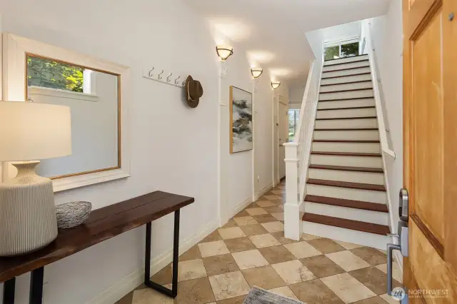 Entryway with stairs up to main living floor.  One bedroom, laundry, and garage access here.