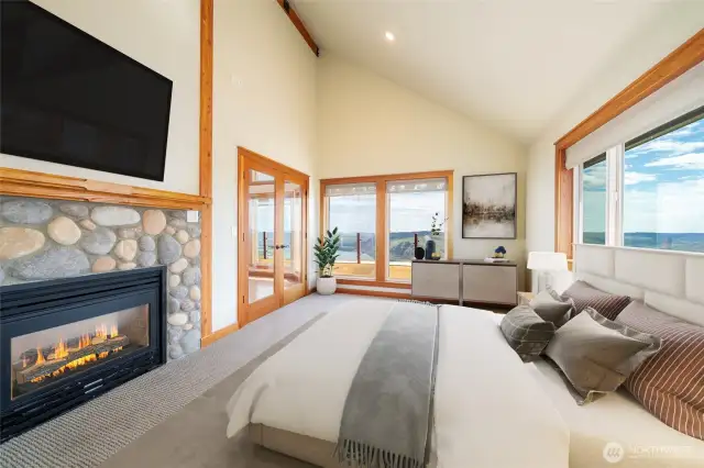 Virtually Staged Primary Bedroom w/ French doors & double sided firplace
