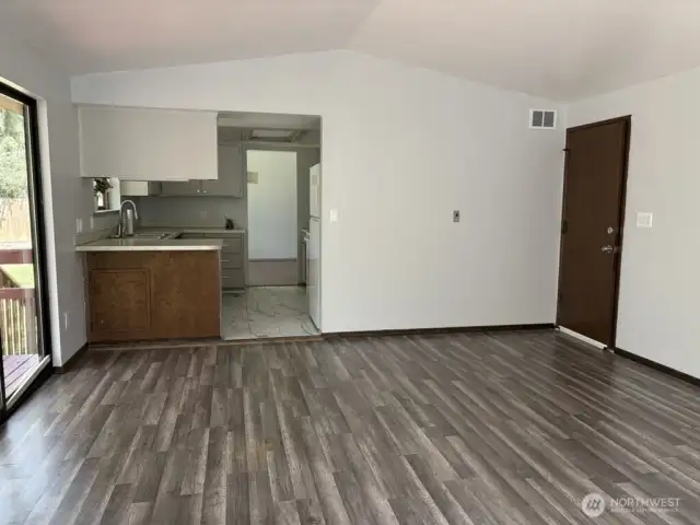 View from Family Room to Kitchen and Garage access.