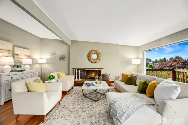 Living Room with wood burning fireplace and green/territorial views.