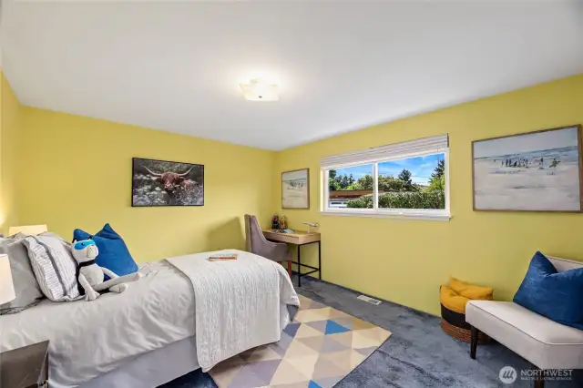 Second bedroom on main with south facing window. Original hardwood floors under carpet.