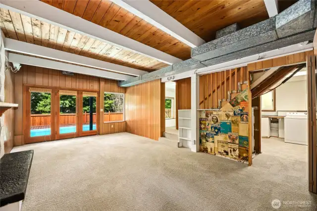Laundry room to right and front bedroom or office space (doorway in center of photo) that overlooks pool and green space.