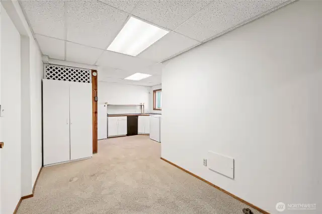 Hallway space between shop and storage space and laundry room.
