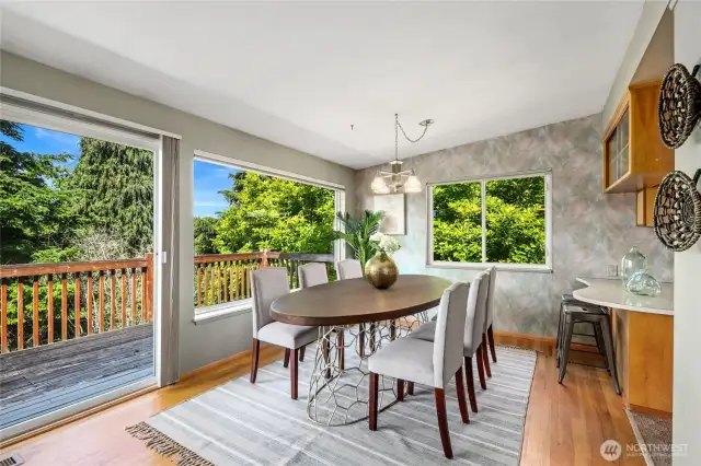 Dining Room off kitchen overlooks private greenbelt.