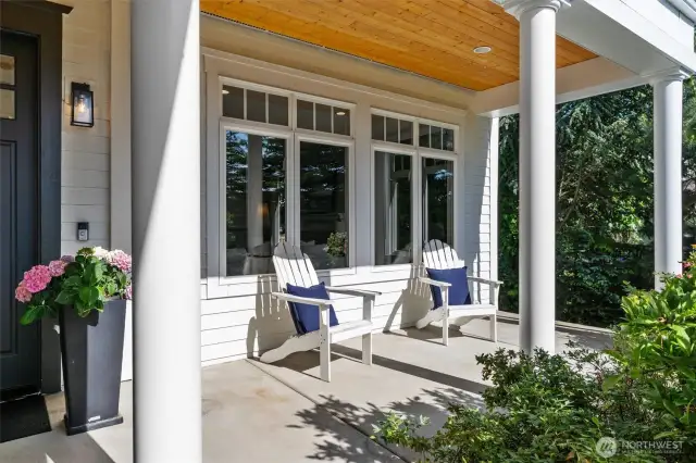 A timeless welcome begins at the covered front porch.