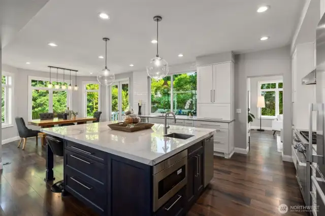 A beautifully renovated kitchen featuring high-end appliances, luxe finishes, and expansive windows for all-day natural light.