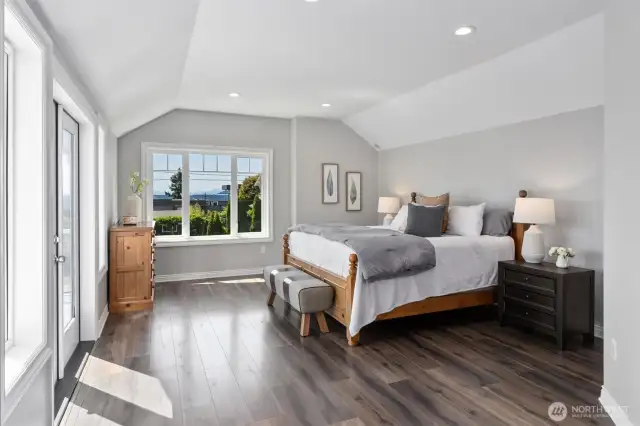 Elegant primary retreat with abundant light and seamless indoor-outdoor flow via French doors.