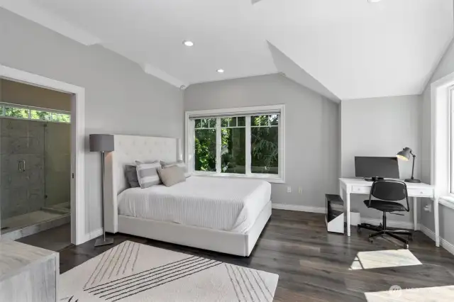 Serene upstairs bedroom with spa-like bath and sunny deck retreat.