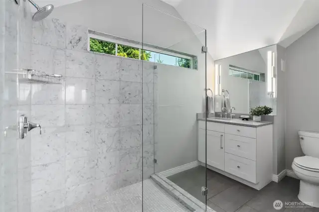 Elegant ¾ bathroom featuring high-end fixtures and finishes.