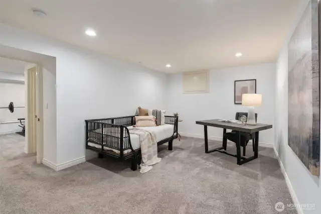Thoughtfully designed lower level flex room offering endless possibilities as a private guest suite, remote work office, or multipurpose retreat.