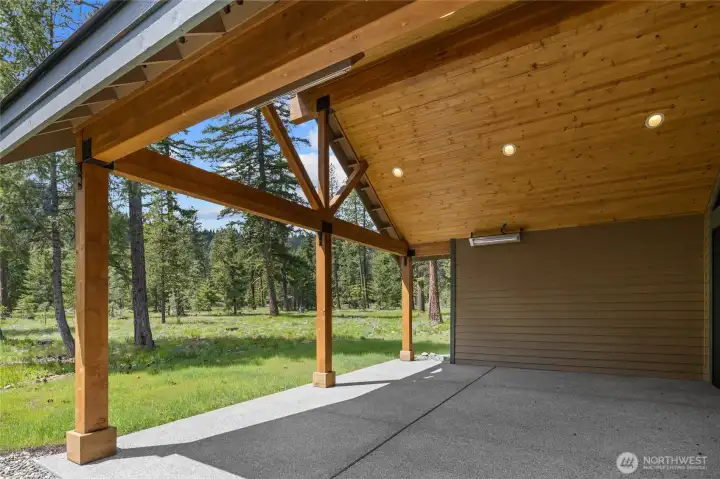 Beautiful covered back porch adjacent to Domerie Park.