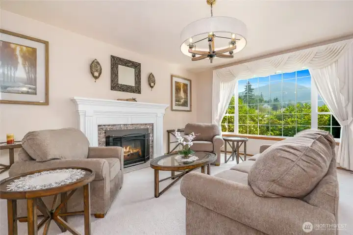 formal living room with gas fireplace.