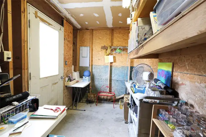 Separate storage room being used as a craft room on the ground level