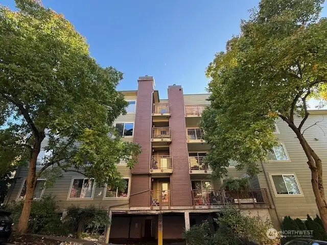 Unit 311 is in the northeast corner with windows on both sides.