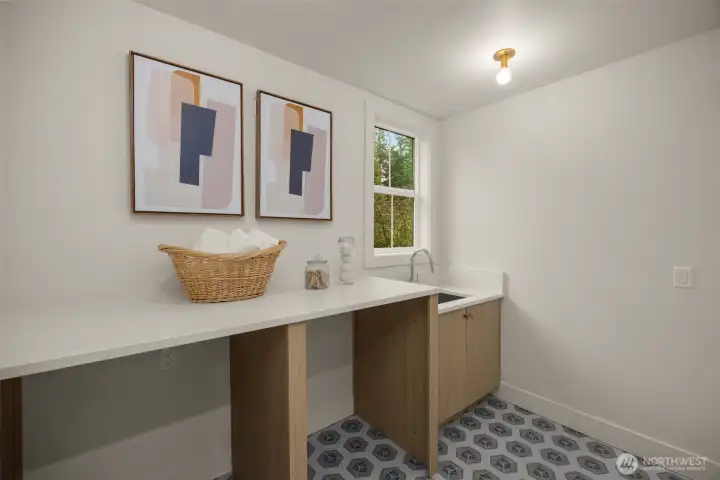 Upstairs laundry room with sink.