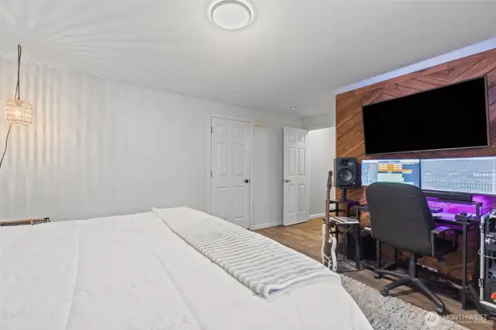 Additional view of lower-level bedroom highlighting privacy and versatility.