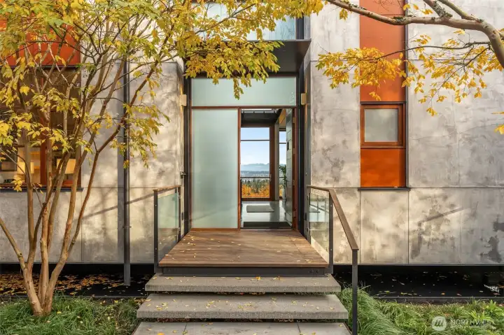 Roof rainwater collected into a steel moat entry water feature