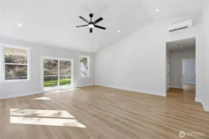 Mini split unit above and in the primary bedroom.  Doorway leads to the primary and two extra bedrooms.