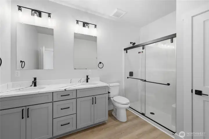 Primary bathroom, linen closet on the right.