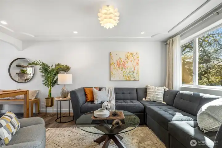 Large picture window frames the living room