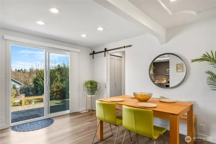 These sliders lead you directly to the pavered patio dining area and the detached studio in large back yard