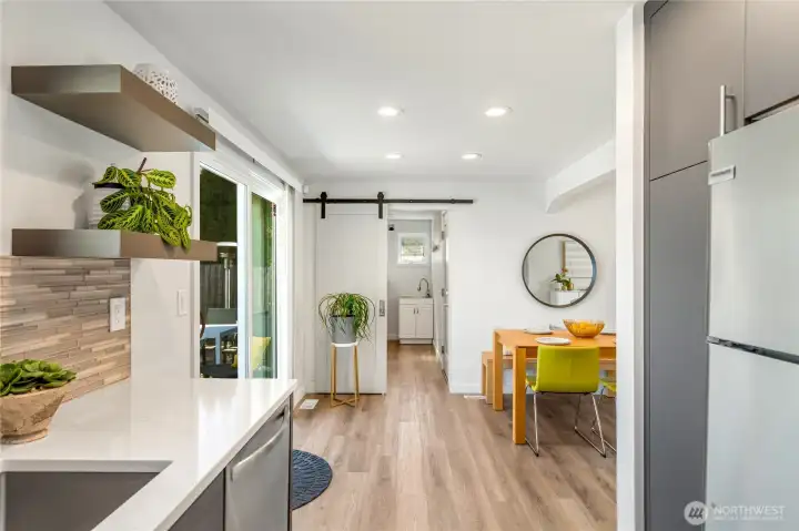 Slider at end of photo leads to pantry space, laundry and attached garage