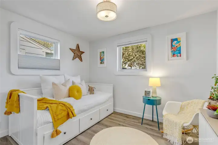 2nd bedroom with custom shades and a double closet.  Current owner used this as their media/office space